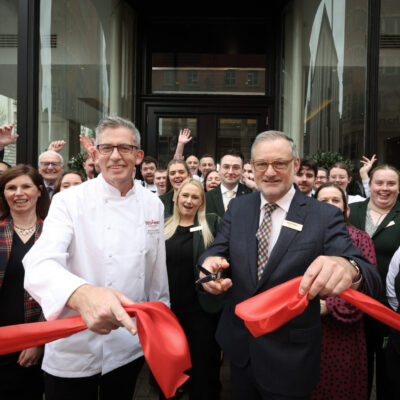 Executive Head Chef (L) Noel McMeel and General Manager (R) Mike Gatt cut the ribbon alongside The Bedford Hotel team, marking an exciting new chapter.